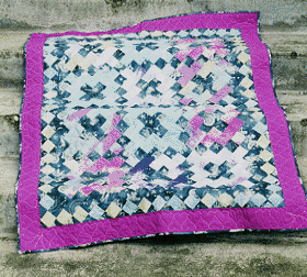 A crib-sized Album quilt reminds me of the Grateful Dead.